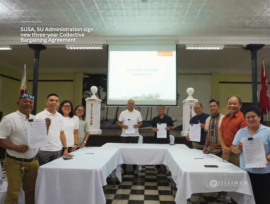 The eleven members of the SUSA negotiating panel pose after affixing their signatures.