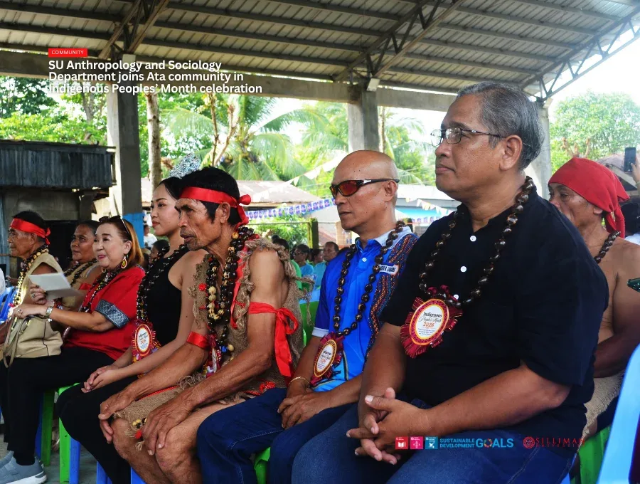 Guests sit alongside the Council of Elders during the program.