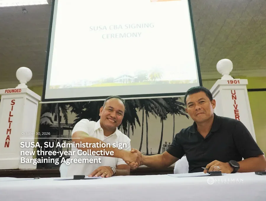 Atty. Richard Catacutan (left), chair of the SU Administration’s negotiating panel, shakes hands with SUSA President VcPierre Calunsag during the signing of the three-year CBA.