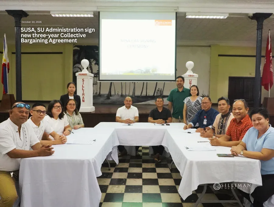The eleven-members of the SUSA negotiating panel (seated) with representative SUSA officers (back) pose after the signing ceremony.