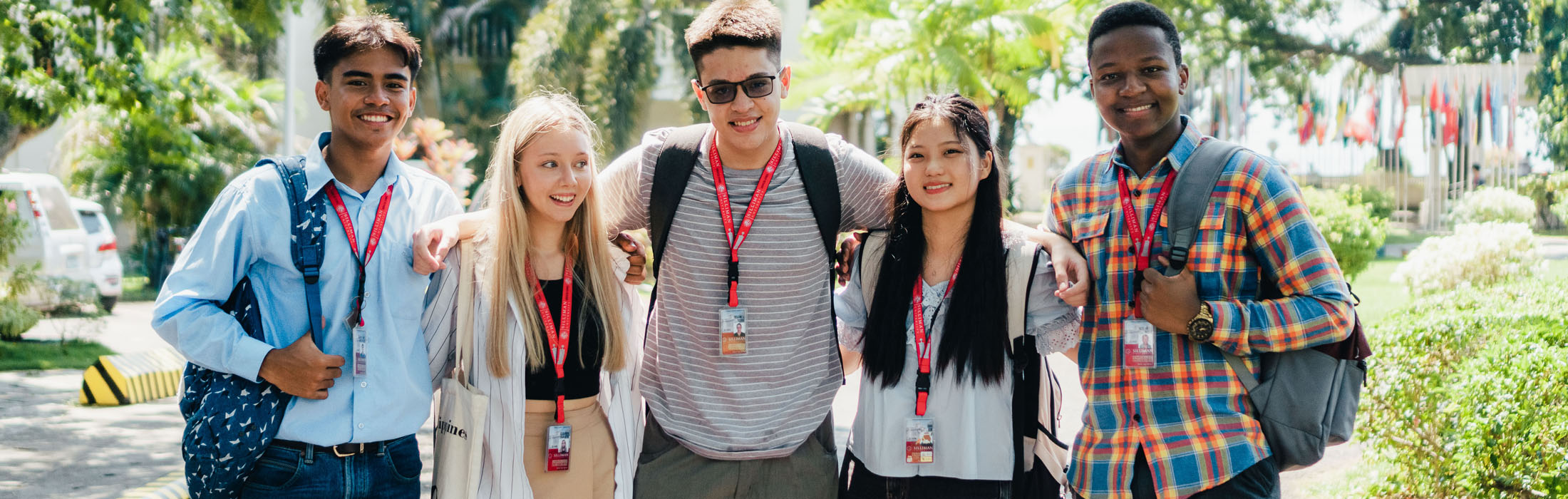 A group of smiling Silliman students on campus