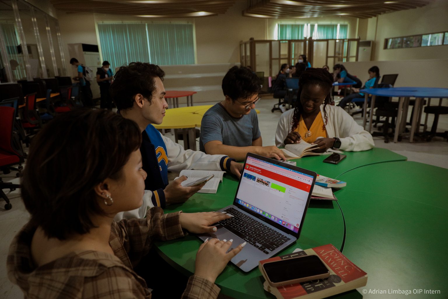 Students studying together at a table in the library